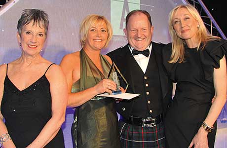 The Great Place to Work Award, won by JW Filshill and  sponsored by SHS Sales & Marketing. From left to right: Kate Salmon, executive director, SWA; Anne-Marie Johnstone, KeyStore area manager, JW Filshill; SHS Sales & Marketing’s senior national account manager, Martin Dyer; and Cathy Macdonald.