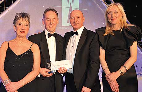Andy Stevens, head of sales UK, JTI for the presentation of the Best Delivered Operation (Retail) Award.