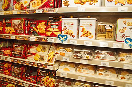 Mitchells of Inverurie shoppers like to see local bakery specialities like butteries on shelf, left. The store also has its own-brand range of biscuits and cakes. The Walkers and Border Biscuits display at Brownlie’s in Biggar, right. The gifting and sharing packs are popular with shoppers all year round, according to owner-manager Bruce Morgan. 