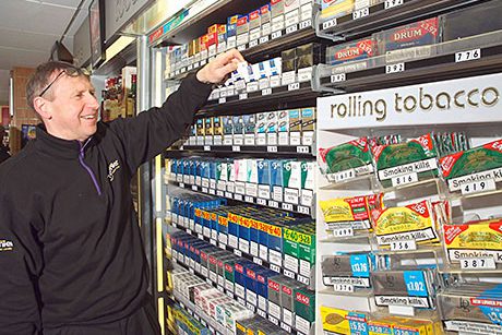 Dennis Williams at the tobacco gantry at Broadway Convenience Store in Oxgangs in Edinburgh. Troops returning from Afghanistan boosted sales of Lambert & Butler. RYO brands are doing well. And the store’s till system includes full age-restricted product prompts.
