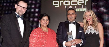 Iain Gulland, director of award sponsor Zero Waste Scotland, left, and Denise Van Outen, right, present the Scottish Grocer Sustainable Retailer of the Year award to Premier Mo’s Convenience Store in Blantyre.