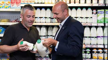 Scott Graham, owner of McLeish in Inverurie, left, and  Barry Cuthbertson of Muller Wiseman Dairies discuss milk ranging and merchandising.