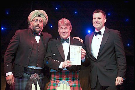 Norman Sinclair, centre, MD of Sinclair Breweries, picks up Orkney Dark Island Reserve’s Scotland Food and Drink Excellence Award.