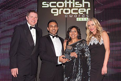 Shaun’s Premier Store, Cardonald in Glasgow receives the Best Soft Drinks Outlet of the Year Award at the Scottish Grocer Awards 2013 dinner earlier this year.