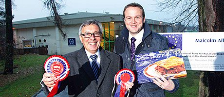 Top food firm enters new era Gordon Allan, director of Malcolm Allan, left, and Gordon Robinson, Bank of Scotland relationship director, right, outside the new Malcolm Allan headquarters in Larbert. The new plant was developed after a £2.9m finance deal with Bank of Scotland was agreed.