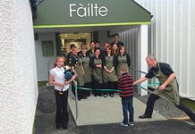 Ronald Maclennan, right, helps some very important people cut the ribbon at Maclennan’s Supermarket on Benbecula.