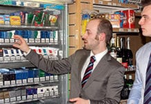 Tim Oates of Imperial Tobacco, left, and Grant MacBean, manger of Lomond Service Station in Jamestown, Alexandria, close to Loch Lomond, discuss the store’s tobacco range.