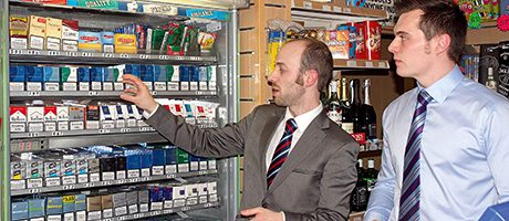 Tim Oates of Imperial Tobacco, left, and Grant MacBean, manger of Lomond Service Station in Jamestown, Alexandria, close to Loch Lomond, discuss the store’s tobacco range.