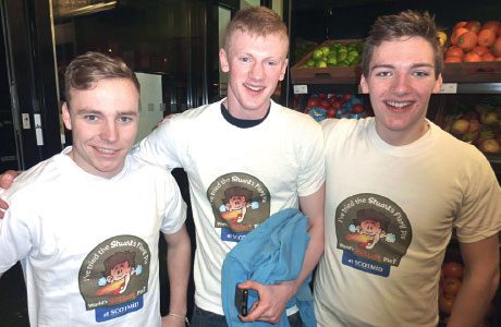 Been there, ate it, got the T-shirt! Three gentlemen in Scotmid show they’re hot stuff after each devouring a Stuart’s Fiery Pie.