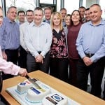 Baking up a hot one hundred Colin McLean, chief operating officer of Scotmid Co-operative cuts the 100th bakery cake watched by Stephen Brown, bakery and local sourcing manager, second left and operations, support and regional business managers.
