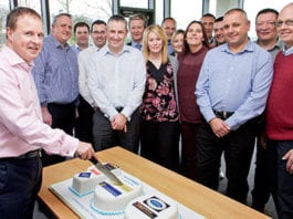 Baking up a hot one hundred Colin McLean, chief operating officer of Scotmid Co-operative cuts the 100th bakery cake watched by Stephen Brown, bakery and local sourcing manager, second left and operations, support and regional business managers.
