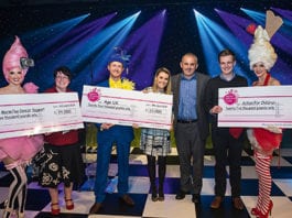 Nisa show presentations make the difference Neil Turton, chief executive of Nisa, third right, and artists at the organisation’s Stoneleigh Park dinner present charity cheques to Age UK, Macmillan Cancer Support and Action For Children.