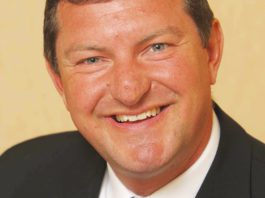 New chair for grocer charity