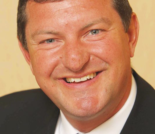 New chair for grocer charity
