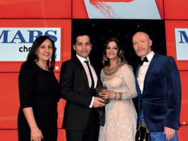 Family store gives heaps of support Bep Dhaliwal, trade communications manager, Mars Chocolate UK, left, and awards event host Craig Hill, right, present the Community Champion Award to Asif Akhtar and Abada Akhtar of Smeaton Stores, Kirkcaldy.