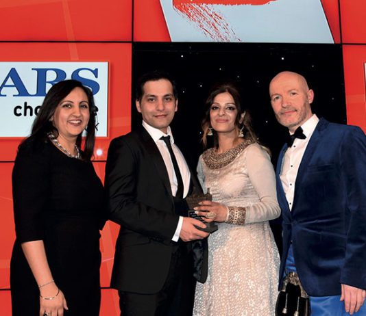 Family store gives heaps of support Bep Dhaliwal, trade communications manager, Mars Chocolate UK, left, and awards event host Craig Hill, right, present the Community Champion Award to Asif Akhtar and Abada Akhtar of Smeaton Stores, Kirkcaldy.