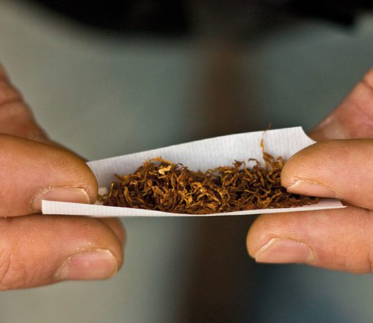 Over half have bought illegal tobacco hands rolling a cigarette