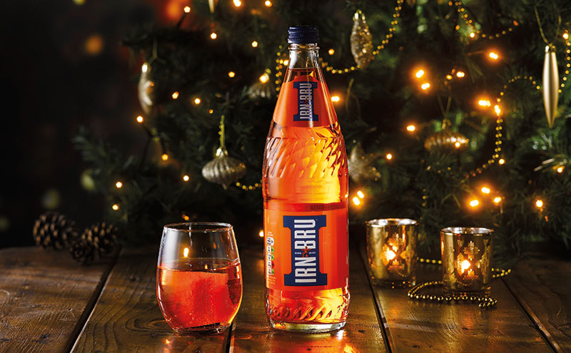 Irn Bru in front of a Christmas tree