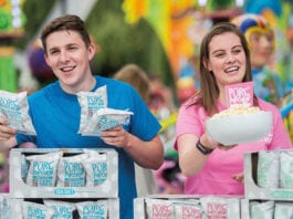 Popping up on shelves People handing out popcorn