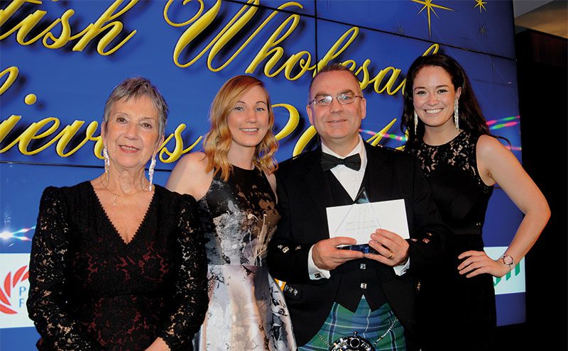 Laura McDermaid, area sales manager at Philip Morris, presents Best Symbol Group to Mike Leonard, Day-Today controller at United Wholesale (Scotland), with Kate Salmon, left, executive director, Scottish Wholesale Association and host Jennifer Reoch of STV.