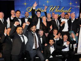 A whole night of triumph for United Andy Stevens, head of sales, JTI, joined on stage by SWA president Kate Salmon and host Jennifer Reoch of STV, presents the Champion of Champions award to Asim Sarwar and the team from United Wholesale (Scotland).