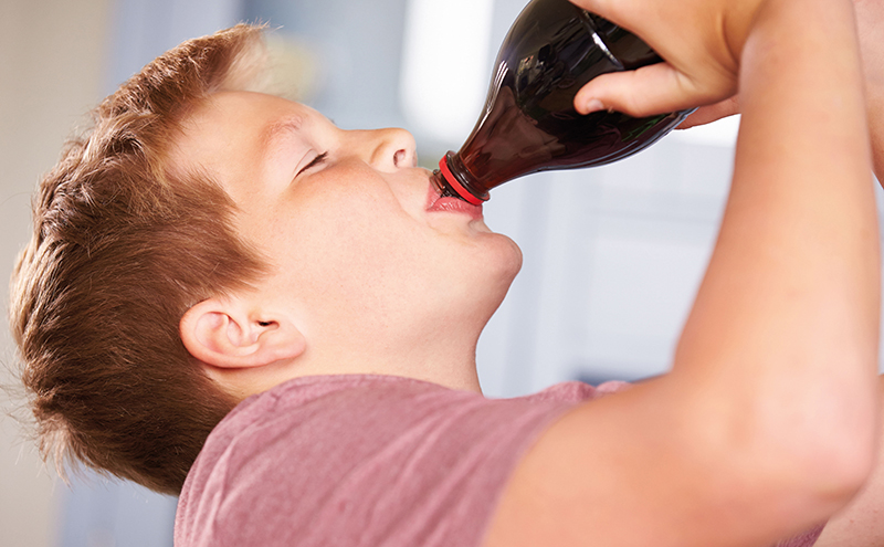 child drinking soft drink