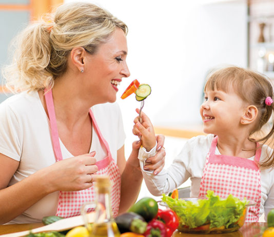 On a health kick Family eating vegetables