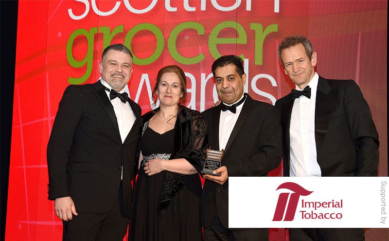 Daniel Harwood, area business manager Imperial Tobacco UK, and Alexander Armstrong present the Tobacco Retailer of the Year award to Tanveer and Lesley Baber, Shawlands News.