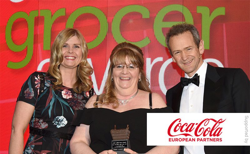 Coca-Cola European Partners and Alexander Armstrong present Best Soft Drinks Outlet of the Year award to Tracy McNeil, Clydebank Co-op Kilbowie.