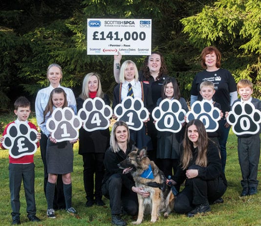 Barking up the right tree Lexi the dog and Scotmid staff, children, and the SSPCA.