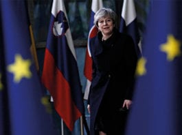 Brexit means challenges Theresa May and EU flags