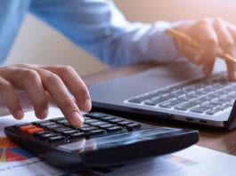 Digital tax date is almost here Person doing sums on a calculator