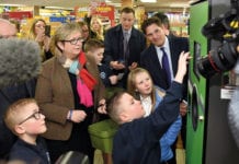 Envipco president Bob Lincoln (right) and Edinburgh South West MP Joanna Cherry watch school kids at the launch of the RVM trial