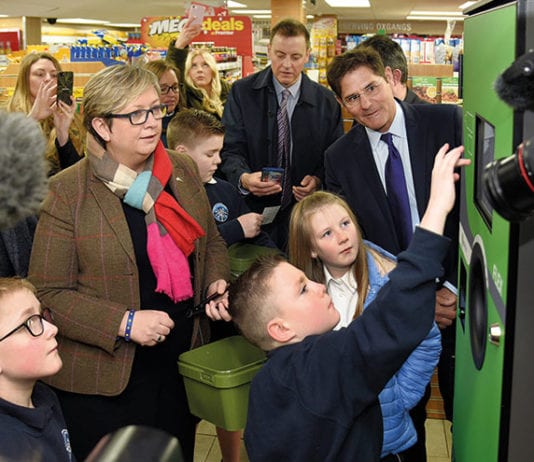 Date set for DRS Envipco president Bob Lincoln (right) and Edinburgh South West MP Joanna Cherry watch school kids at the launch of the RVM trial