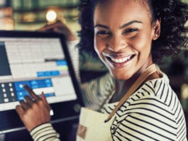 Selling the benefits of retail woman-using-till