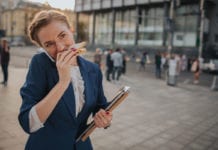 busy-woman-eating-sandwich