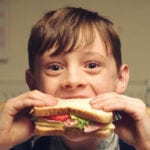 Bread still a big hitter for stores Child eating sandwich