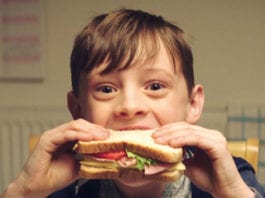 Bread still a big hitter for stores Child eating sandwich