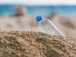 Free the planet plastic bottle on the beach