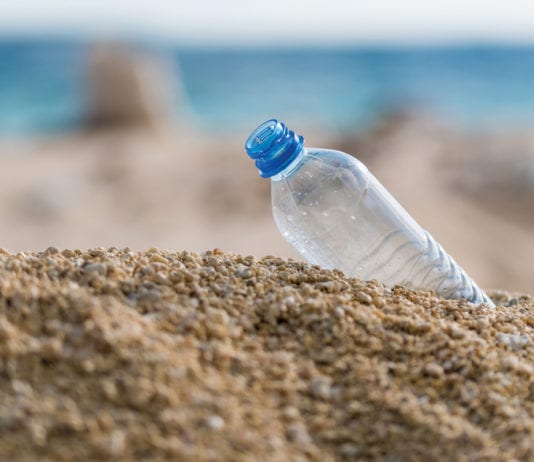 Free the planet plastic bottle on the beach