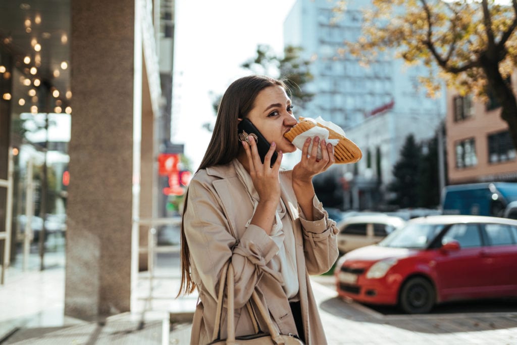 woman eating sandwich