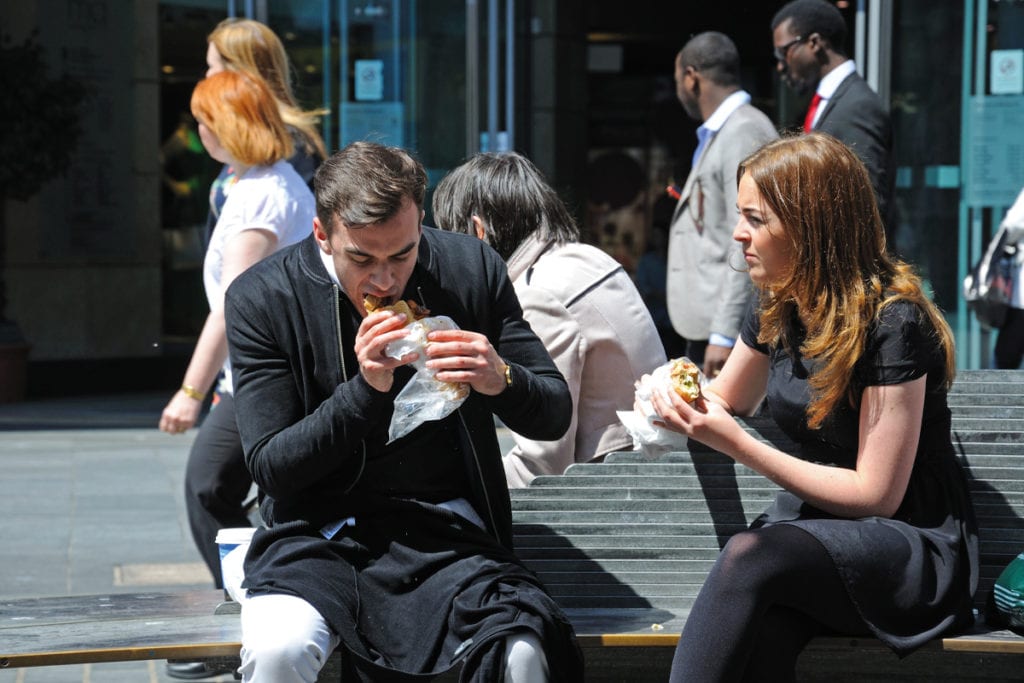 couple eating sandwiches