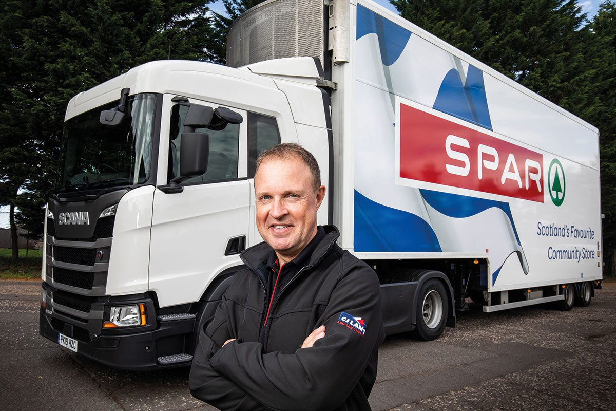 Man In Front Of Spar truck