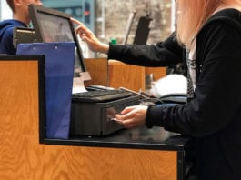 Above inflation wage increase Till Operator Wearing Black