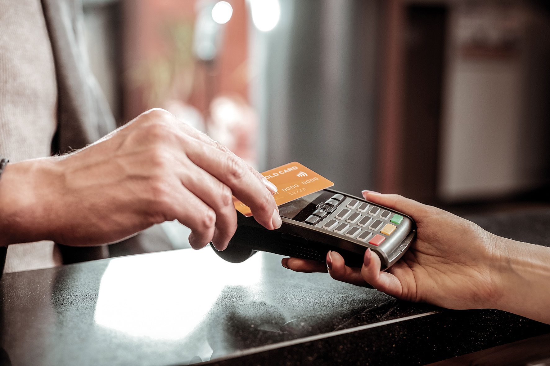 Hand using card machine