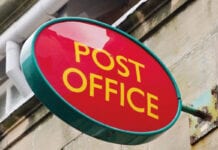 image shows a red post office sign