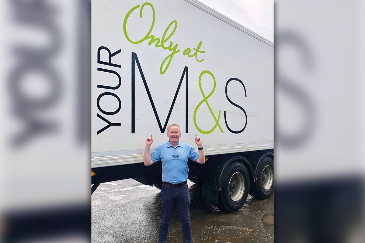 John Galls in front of an M&S lorry