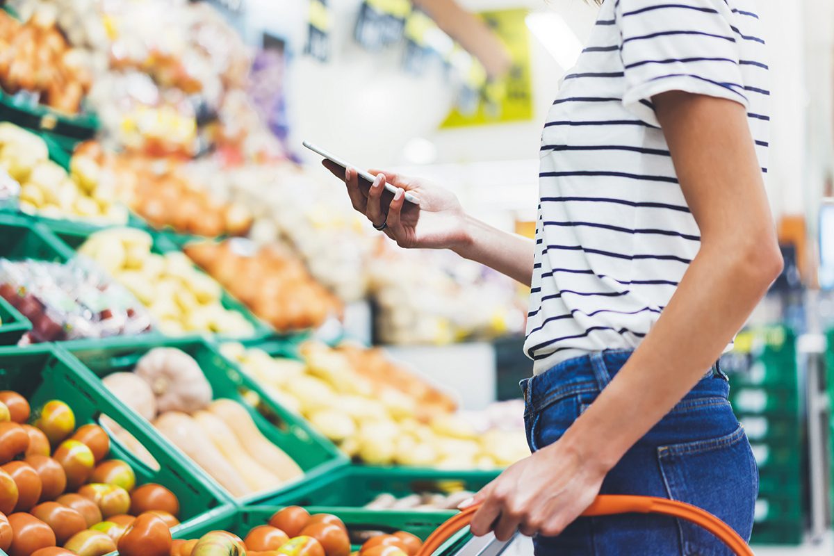 shopper in fruit aisle