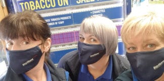 Keystore workers with branded face masks