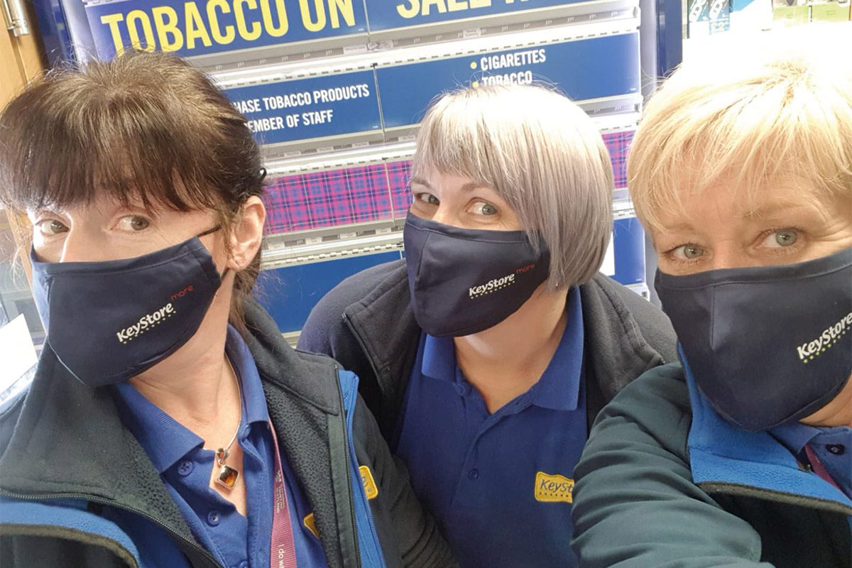 Keystore workers with branded face masks